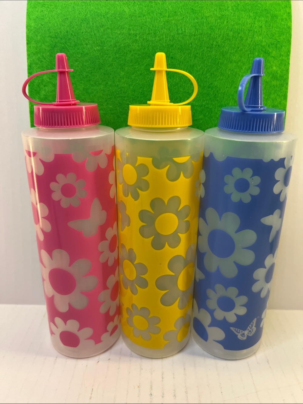 Rate Dolly Parton Pink, Yellow & Blue Daisy Squeeze Bottles - Set of 3